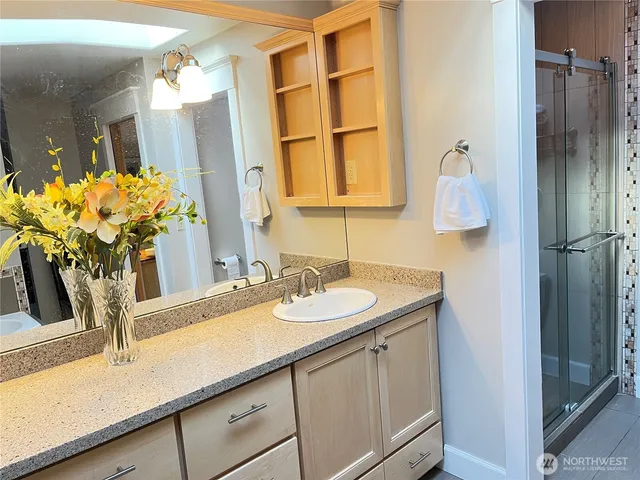 a bathroom with a sink and a mirror