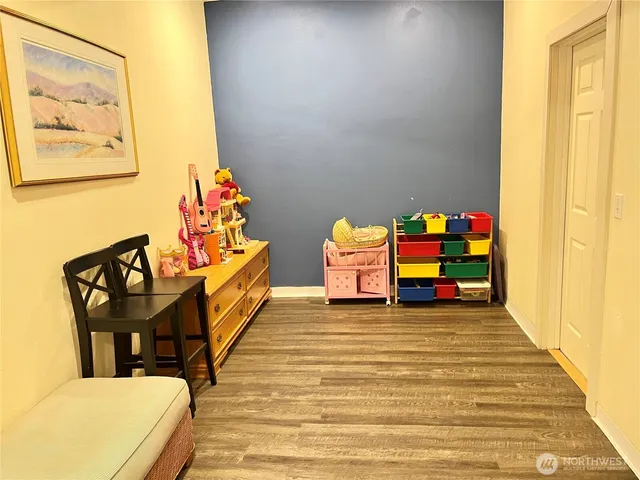 a view of a room with furniture and toys