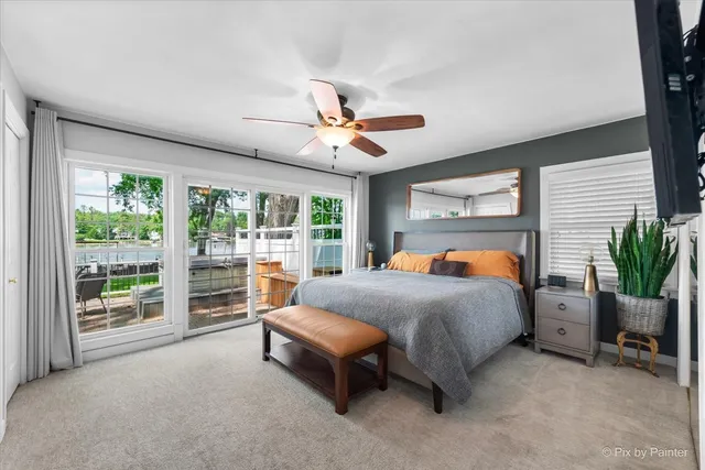 a bed room with a bed and a chair