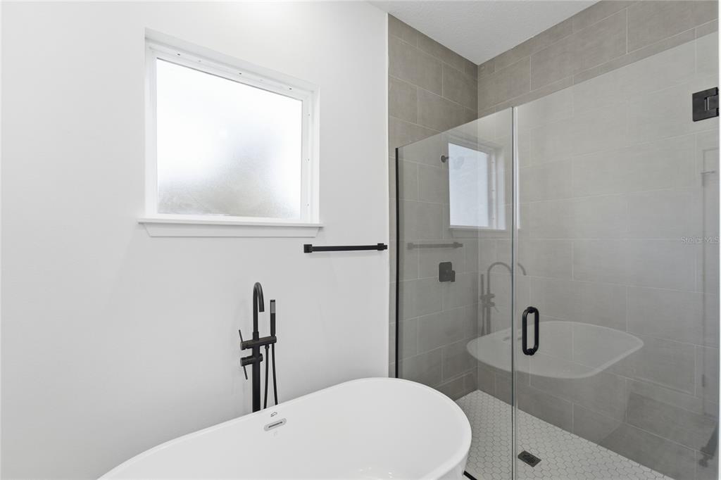 2600 Southwest 146th Pl Road Ocala, FL 34473 - Photo 4 of 40 a bathroom with a sink a toilet and shower