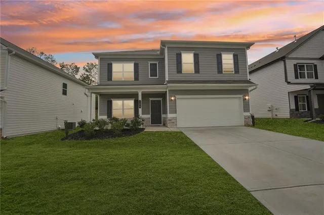 front view of a house with a yard
