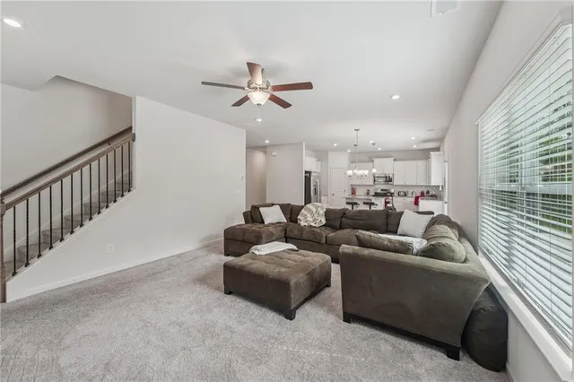 a kitchen with stainless steel appliances granite countertop a stove sink microwave and cabinets