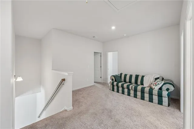 a bedroom with a bed and a ceiling fan