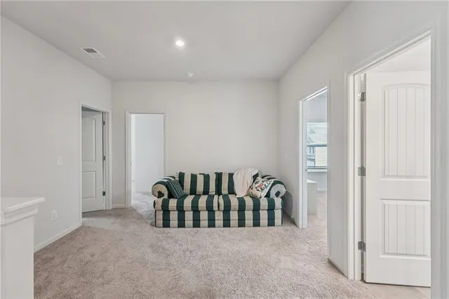 a bedroom with a bed and a tv on the dresser