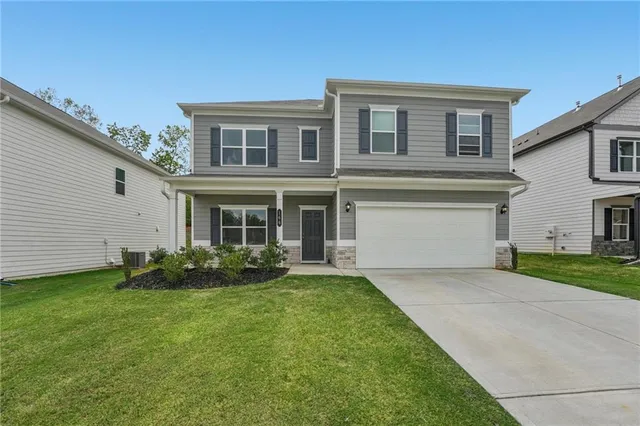 front view of a house with a yard