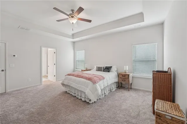 a bathroom with a granite countertop sink a mirror and a shower