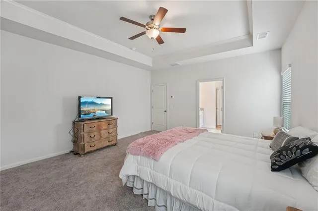 a spacious bathroom with a granite countertop double vanity sink mirror and shower