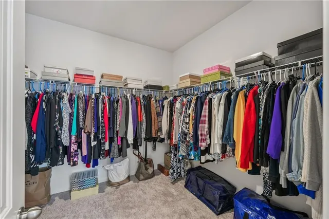 a white bath tub sitting next to a shower