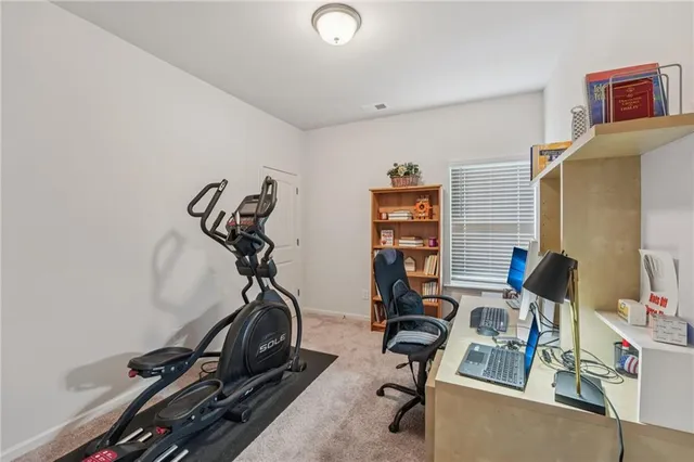 a view of a backyard with sitting area