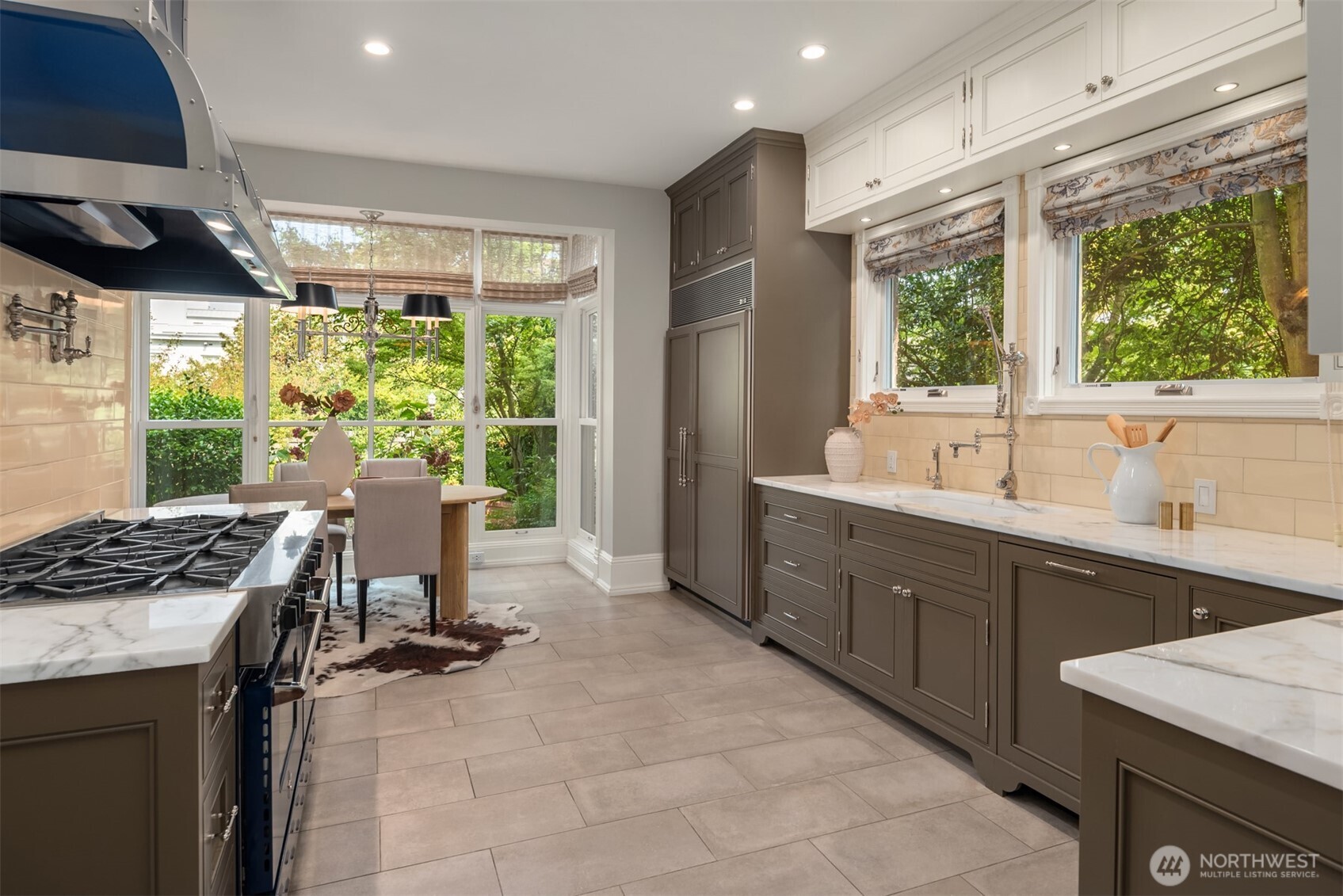 718 East Aloha Street, Unit 10 Seattle, WA 98102 - Photo 12 of 40 a kitchen with kitchen island a large window in it