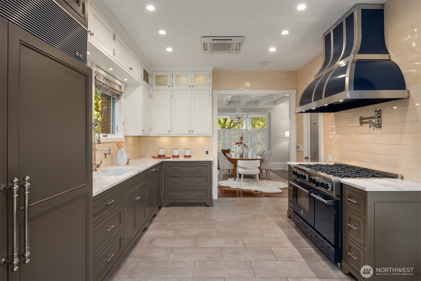 718 East Aloha Street, Unit 10 Seattle, WA 98102 - Photo 13 of 40 a kitchen with stainless steel appliances granite countertop a stove a sink and a microwave