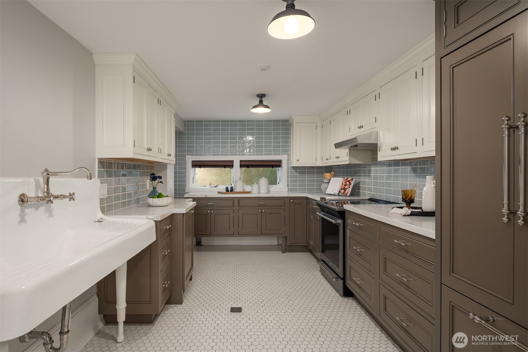 718 East Aloha Street, Unit 10 Seattle, WA 98102 - Photo 22 of 40 a kitchen with stainless steel appliances a sink stove and cabinets