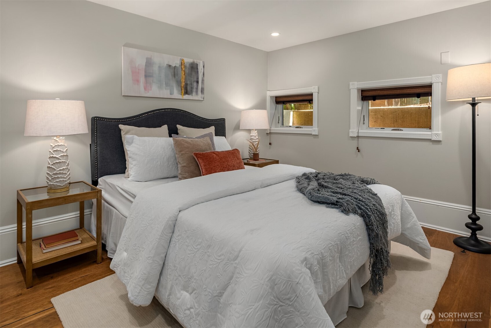 718 East Aloha Street, Unit 10 Seattle, WA 98102 - Photo 25 of 40 a bedroom with a bed and a lamp on dresser