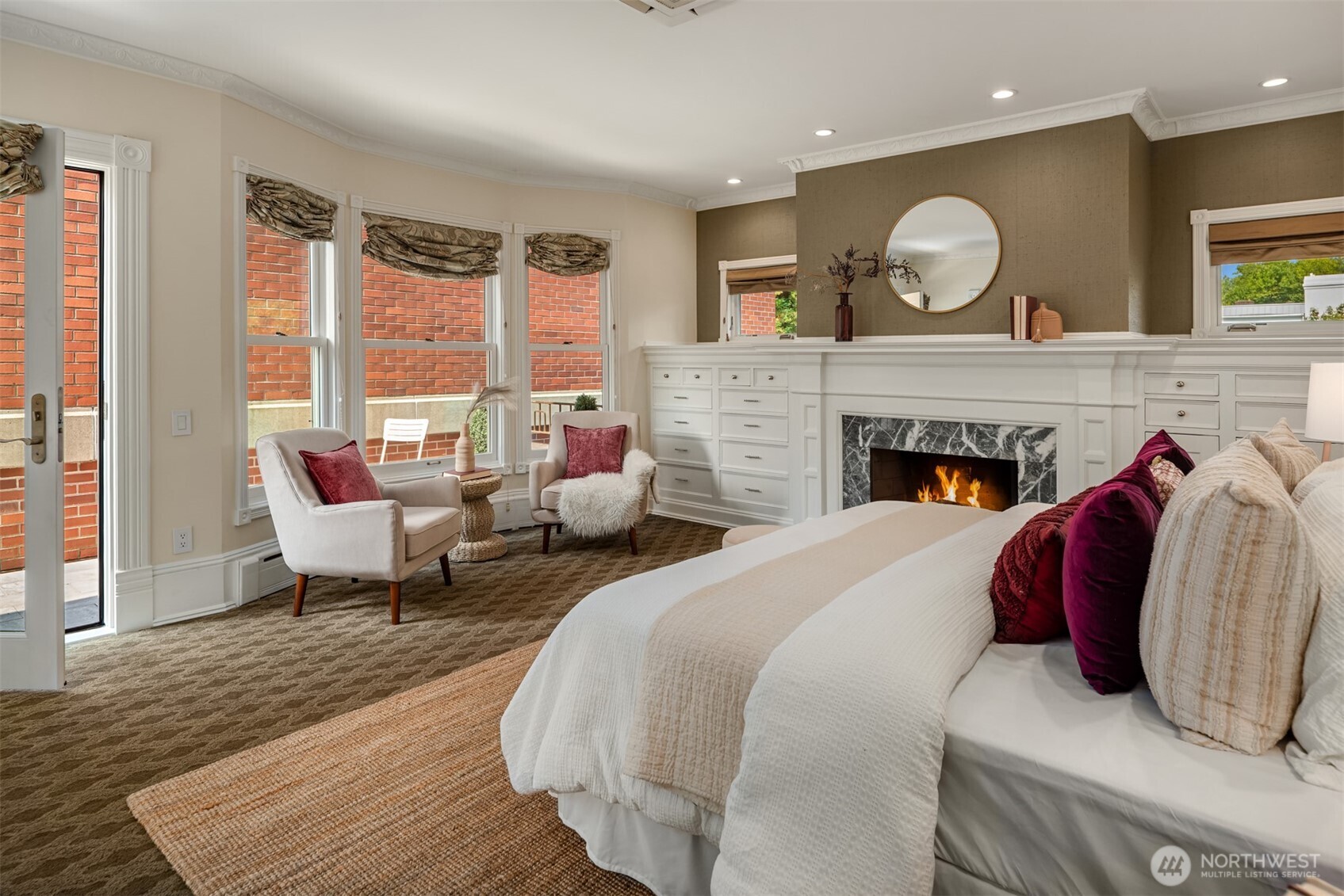 718 East Aloha Street, Unit 10 Seattle, WA 98102 - Photo 27 of 40 a bed room with a bed and a fireplace