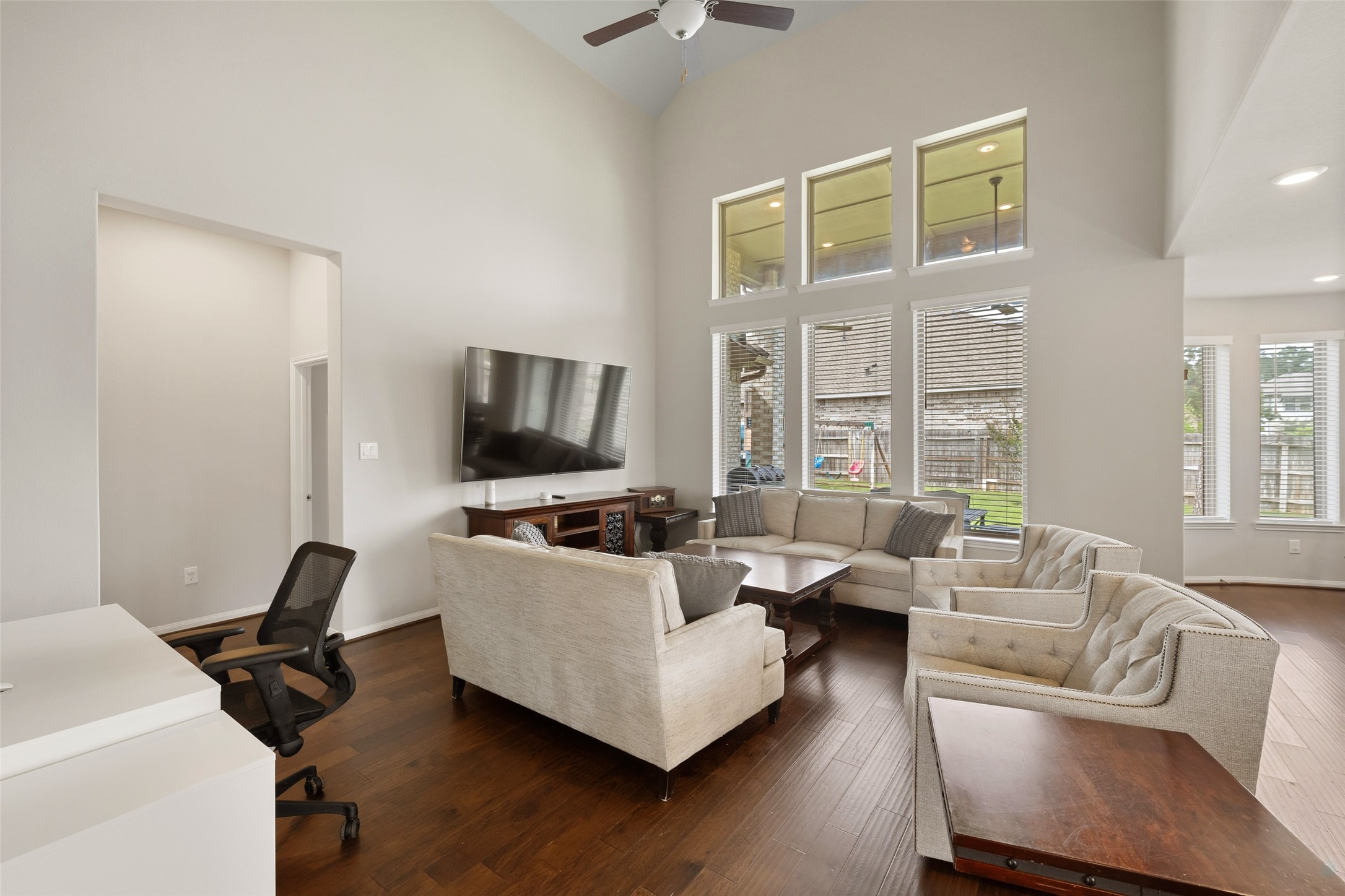 17323 Grand Canyon Road Conroe, TX 77302 - Photo 4 of 33 Lofty ceiling in the family room elevates the experience. Grounded in gleaming engineered hardwoods.