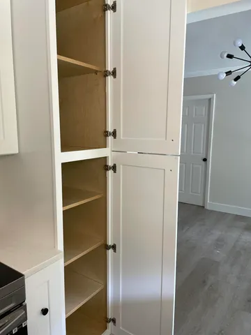 a view of an empty walk in closet