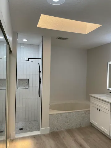 a bathroom with a shower and a tub