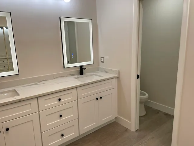 a bathroom with a sink and a mirror