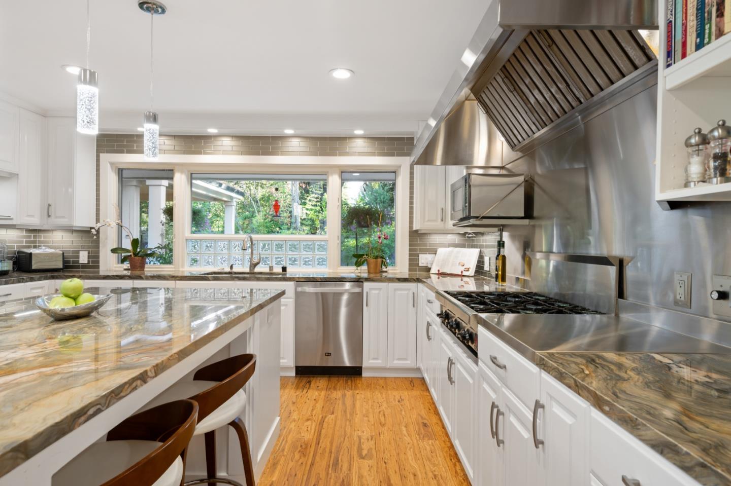 89 Selby Lane Atherton, CA 94027 - Photo 13 of 59 a kitchen with a stove a sink and a refrigerator
