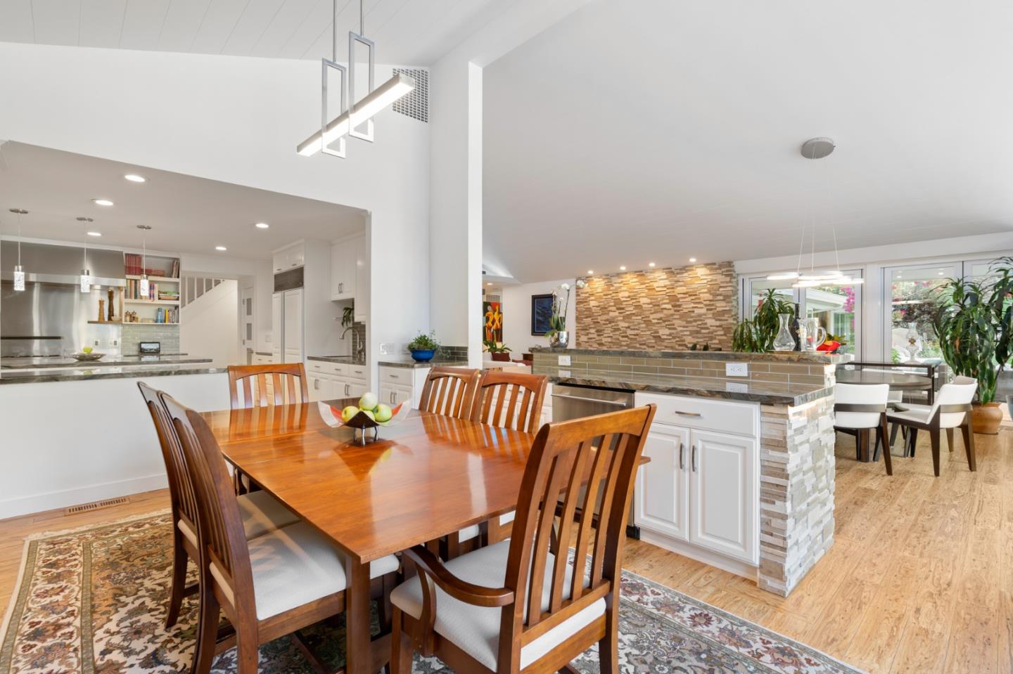89 Selby Lane Atherton, CA 94027 - Photo 15 of 59 a dining room with furniture a chandelier and wooden floor