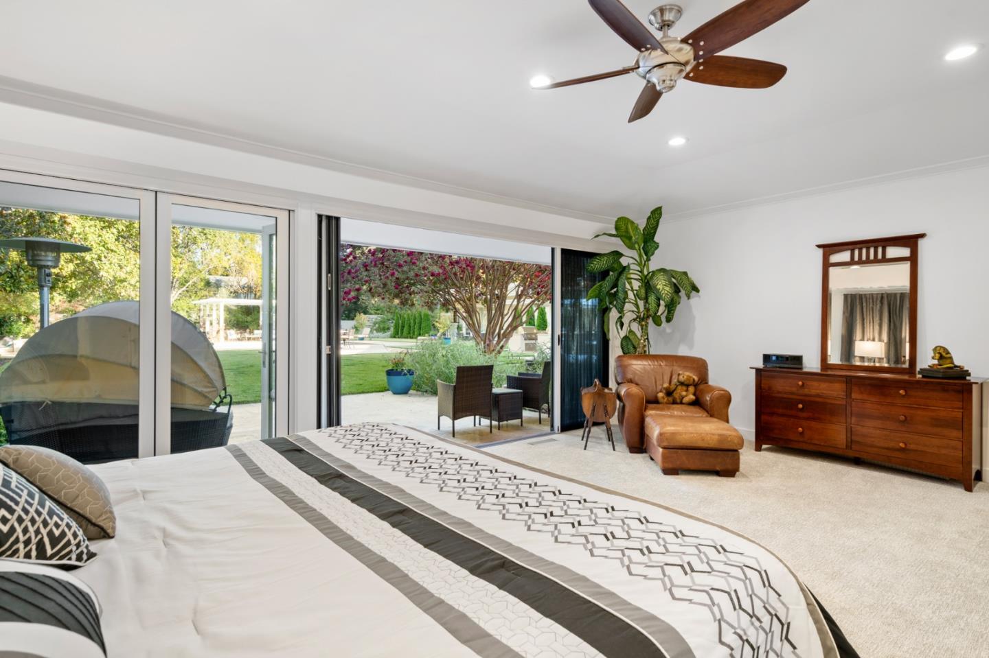 89 Selby Lane Atherton, CA 94027 - Photo 21 of 59 a bedroom with a bed and a large window