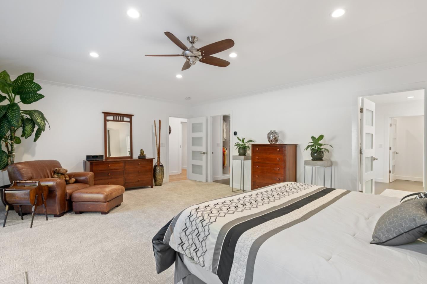 89 Selby Lane Atherton, CA 94027 - Photo 23 of 59 a bedroom with a bed couch and a potted plant