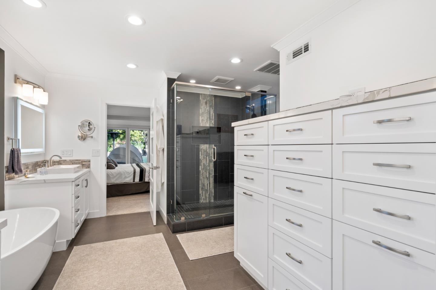 89 Selby Lane Atherton, CA 94027 - Photo 24 of 59 a bathroom with a double vanity sink and mirror
