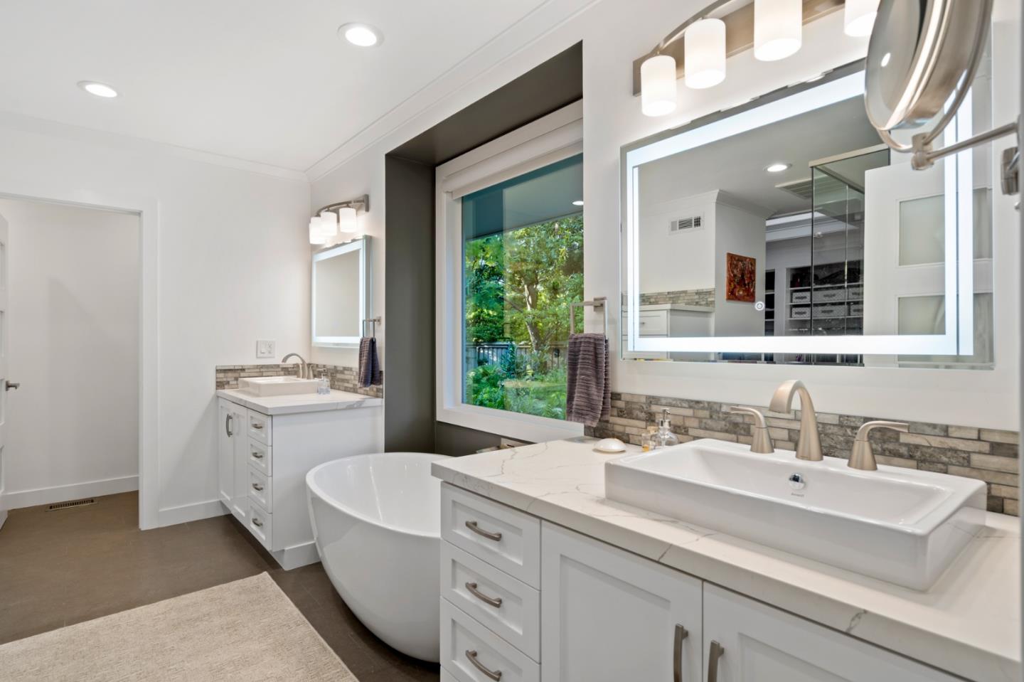 89 Selby Lane Atherton, CA 94027 - Photo 25 of 59 a bathroom with a sink vanity granite tub and view