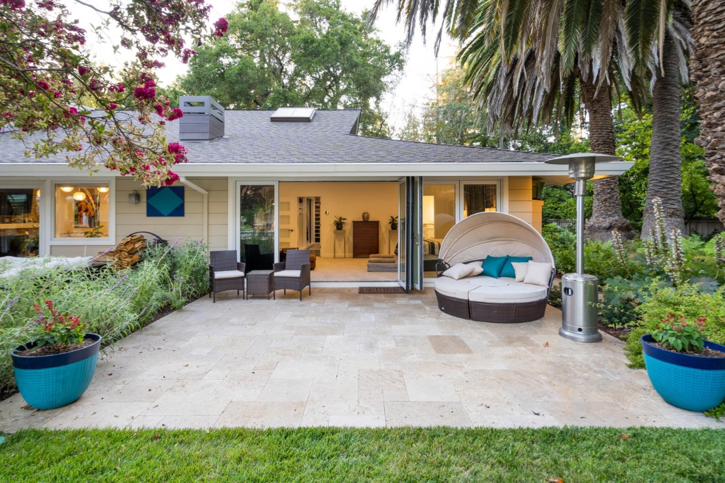 89 Selby Lane Atherton, CA 94027 - Photo 28 of 59 a view of a house with patio and a garden