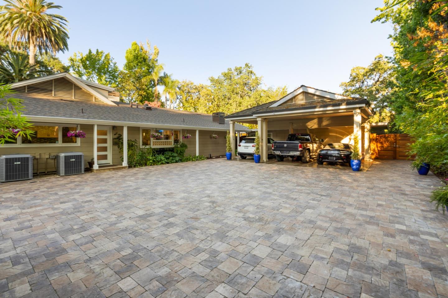 89 Selby Lane Atherton, CA 94027 - Photo 30 of 59 a view of a house with a patio and a yard