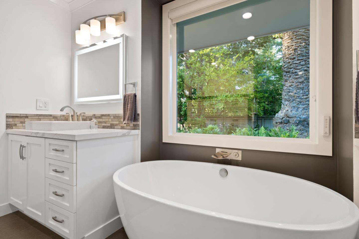 89 Selby Lane Atherton, CA 94027 - Photo 32 of 59 a white bath tub sitting next to a window
