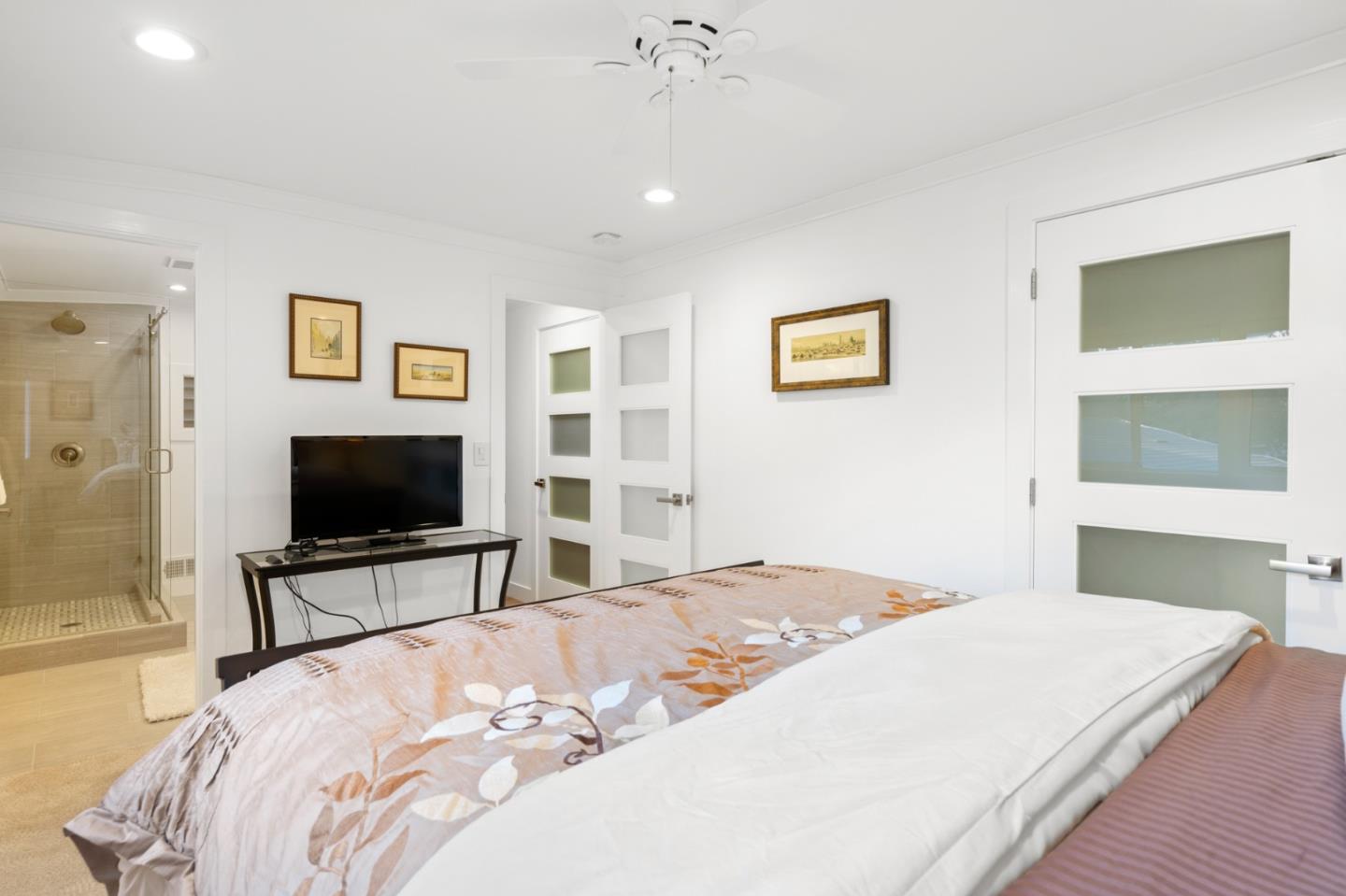 89 Selby Lane Atherton, CA 94027 - Photo 43 of 59 a bedroom with a bed and a flat screen tv