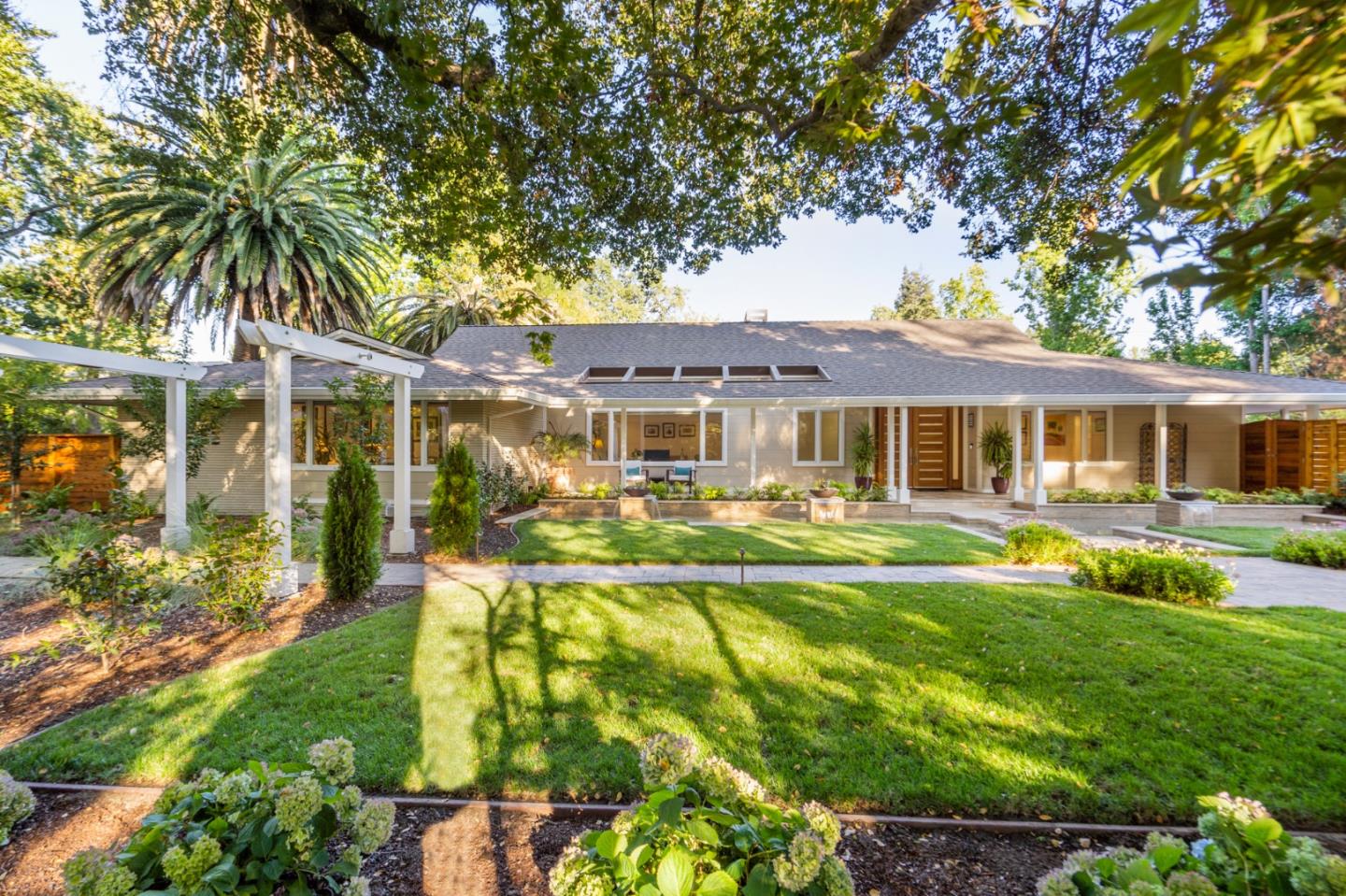 89 Selby Lane Atherton, CA 94027 - Photo 44 of 59 a front view of a house with garden
