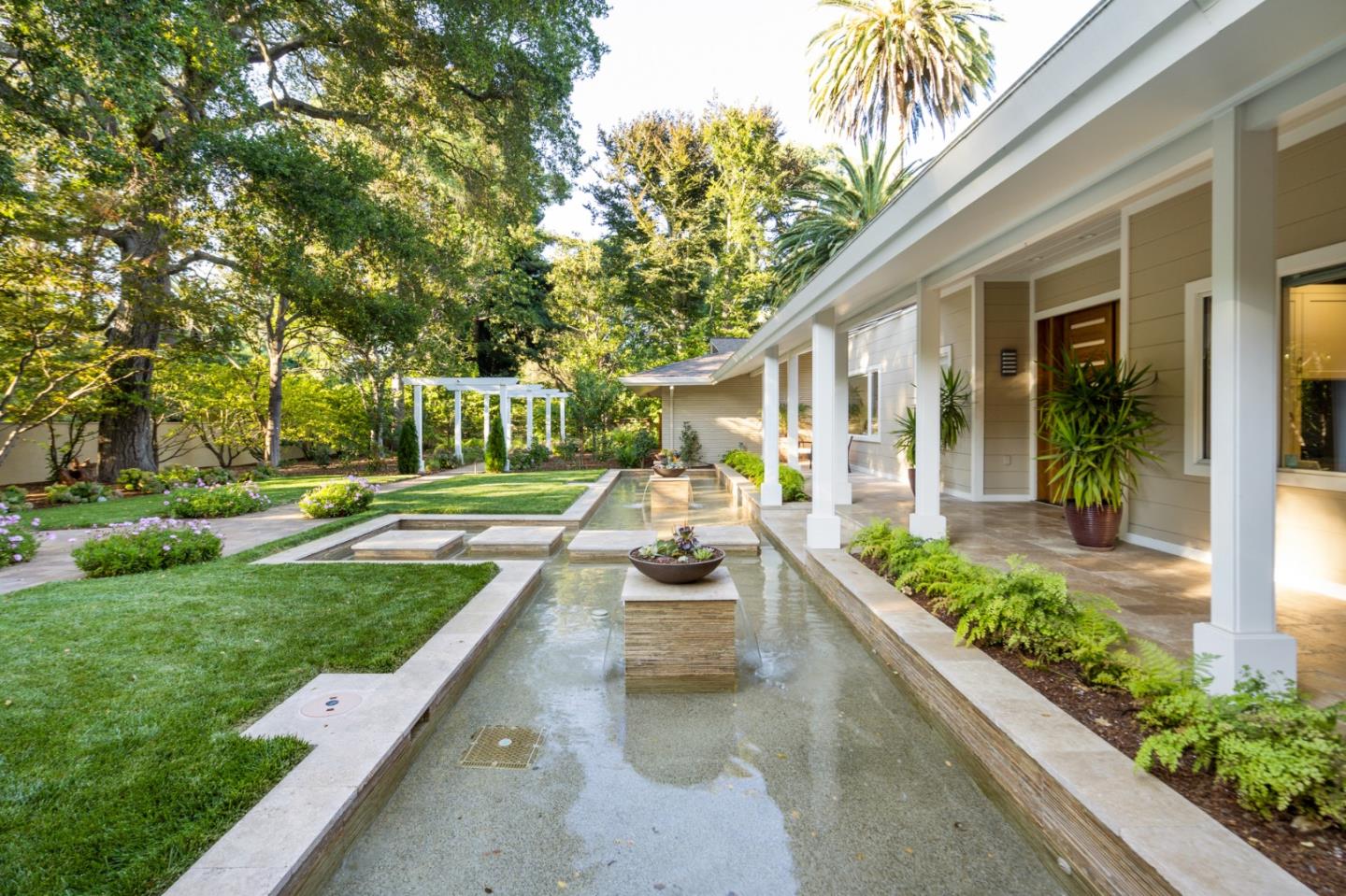 89 Selby Lane Atherton, CA 94027 - Photo 48 of 59 a view of a house with sitting area and garden