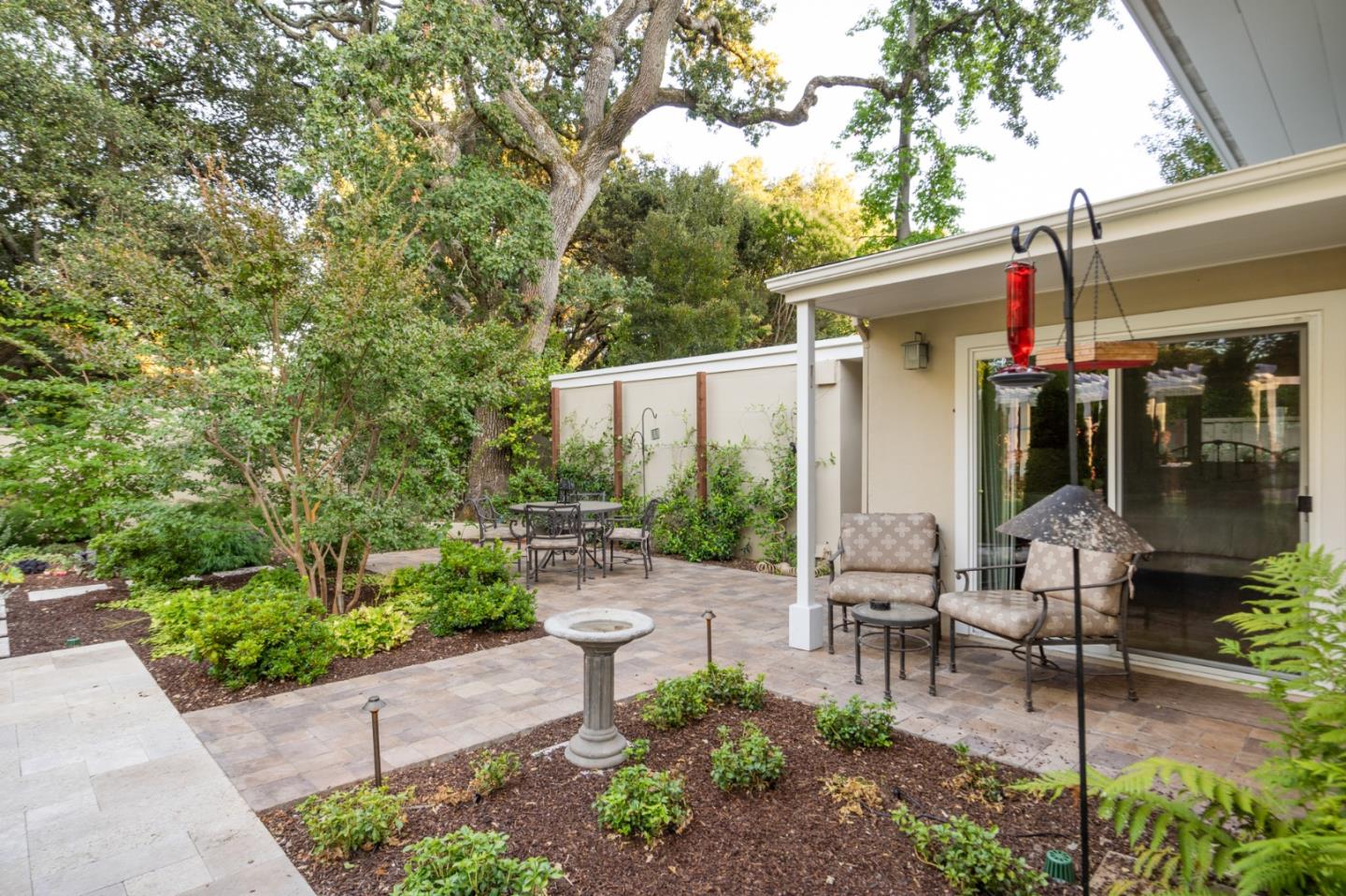 89 Selby Lane Atherton, CA 94027 - Photo 50 of 59 a view of a patio with table and chairs potted plants and large tree