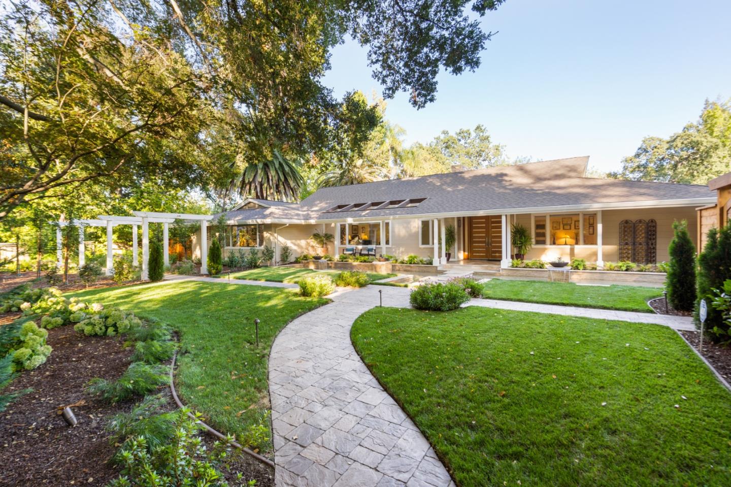 89 Selby Lane Atherton, CA 94027 - Photo 55 of 59 a front view of a house with a yard