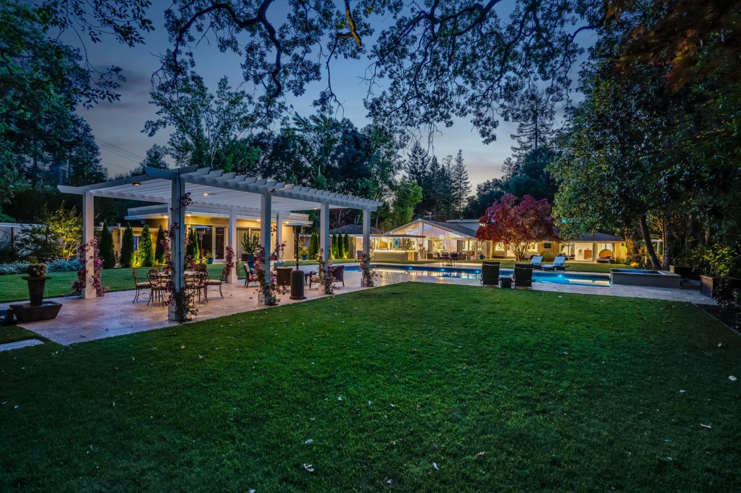 89 Selby Lane Atherton, CA 94027 - Photo 57 of 59 a view of a yard and patio with table and chairs potted plants and large tree