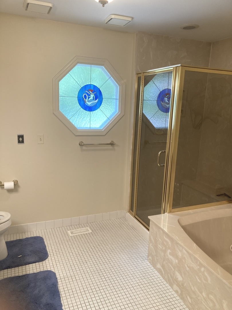 1005 Landing Road Naperville, IL 60540 - Photo 15 of 27 a bedroom with a bed and a wall painting