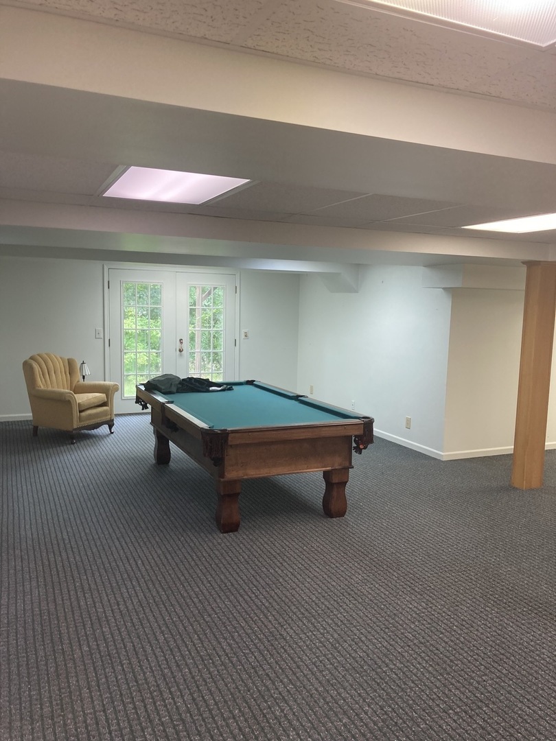 1005 Landing Road Naperville, IL 60540 - Photo 20 of 27 a room with pool table and windows