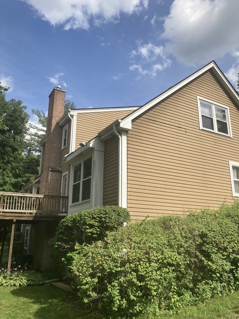 1005 Landing Road Naperville, IL 60540 - Photo 23 of 27 a view of a house with a yard and plants