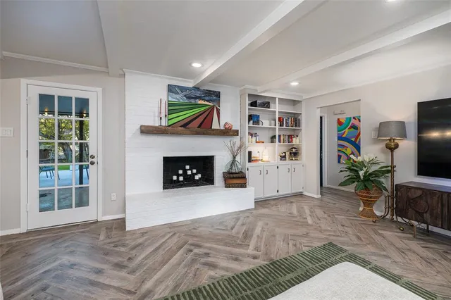 a view of a livingroom with furniture and a fireplace