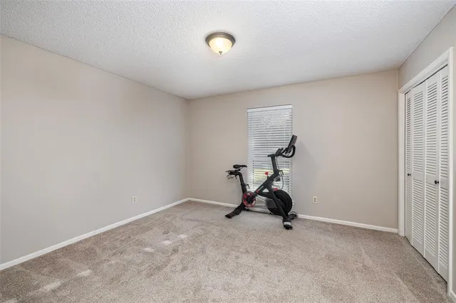 a view of room with gym equipment