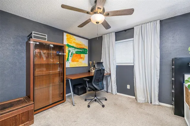 a workspace with furniture and a window