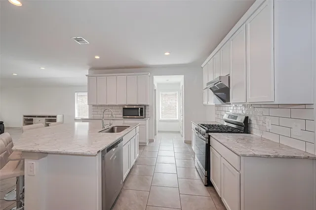 a kitchen with a sink and counter top space