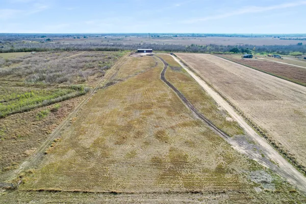 a view of a dry yard with wooden floor