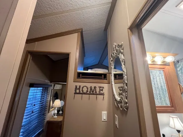 a bedroom with a bed and a mirror