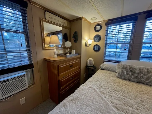 a bedroom with a large bed and a window