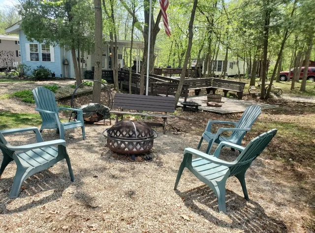 a view of a chairs and table in patio