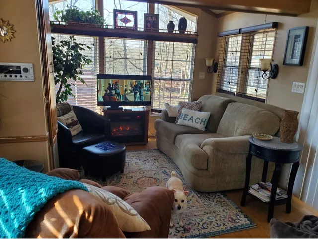 a living room with furniture and a flat screen tv