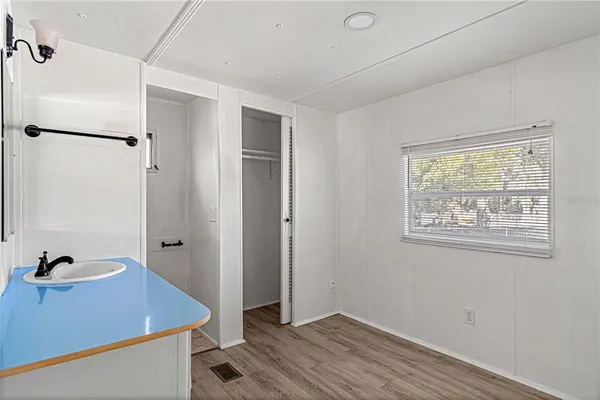 a room that has a window and a wooden floor